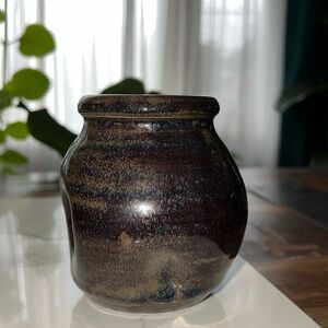 Beautiful pottery vase with dimpled design.